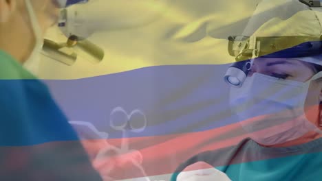 Animación-De-La-Bandera-De-Columbia-Ondeando-Sobre-Los-Cirujanos-En-El-Quirófano.