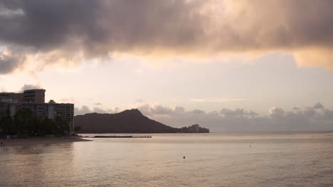 aerial drone shot over pacific ocean of hawaii sunset