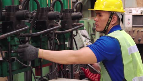 smart factory worker using machine in factory workshop