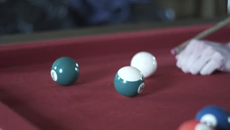 hitting the white ball on a snooker table