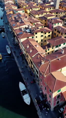colorful italian city with canal and boats