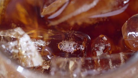 a close-up shot of ice-cold beverage with bubbles capturing the essence of refreshment