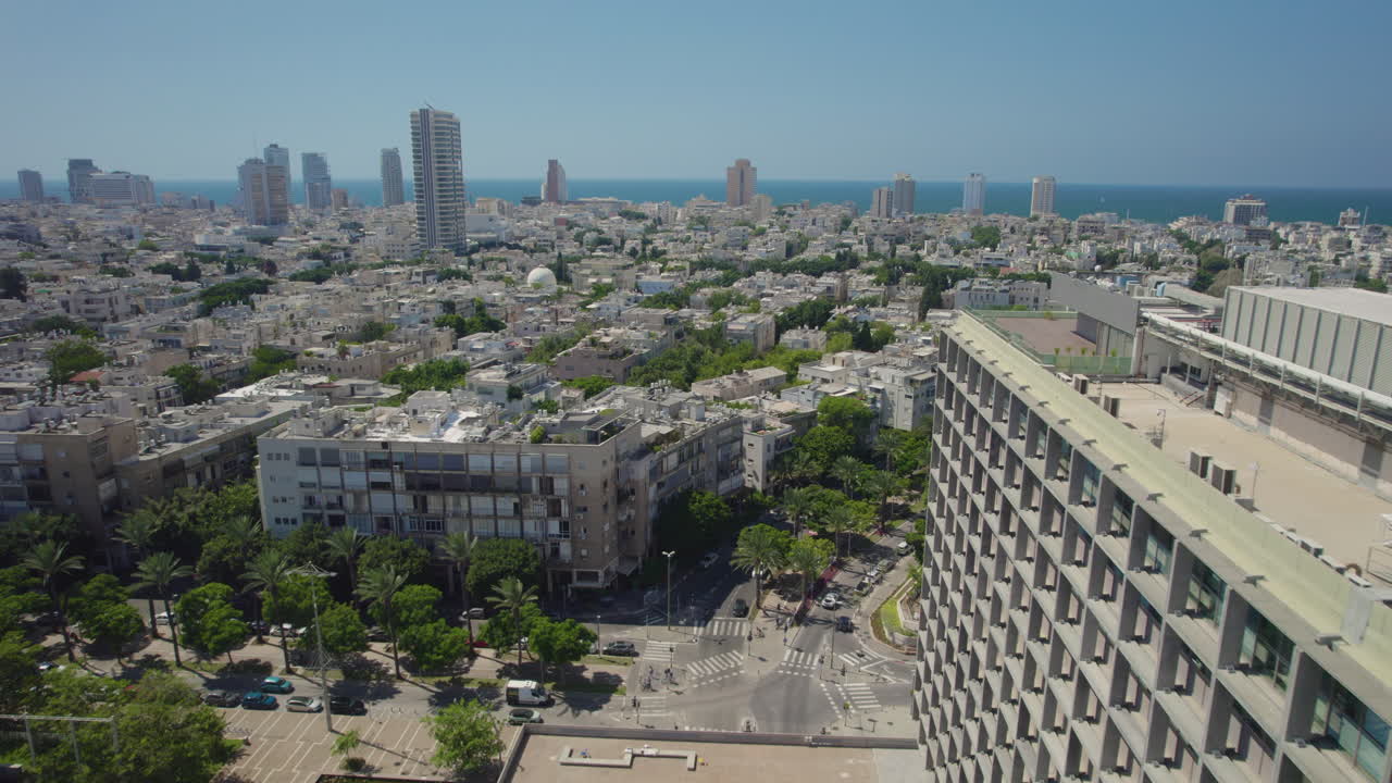 Flight next to the old Tel Aviv City Hall, municipal government center. Around the building People relaxing and enjoying at Gan Ha'ir  Shopping Center and Rabin square - push in shot