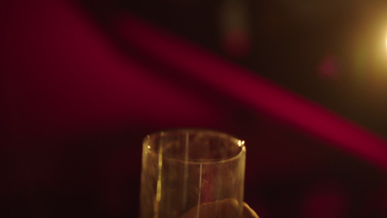 Hand holding a glass