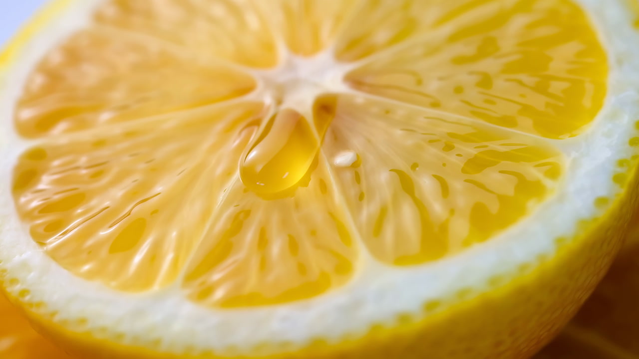 Closeup Yellow Lemon Half With Droplet, Glossy Pulp Detail In Macro, Bright Cool Tones And High Contrast,