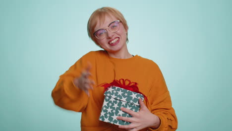 woman presenting birthday gift box offer wrapped present career bonus celebrating party sale