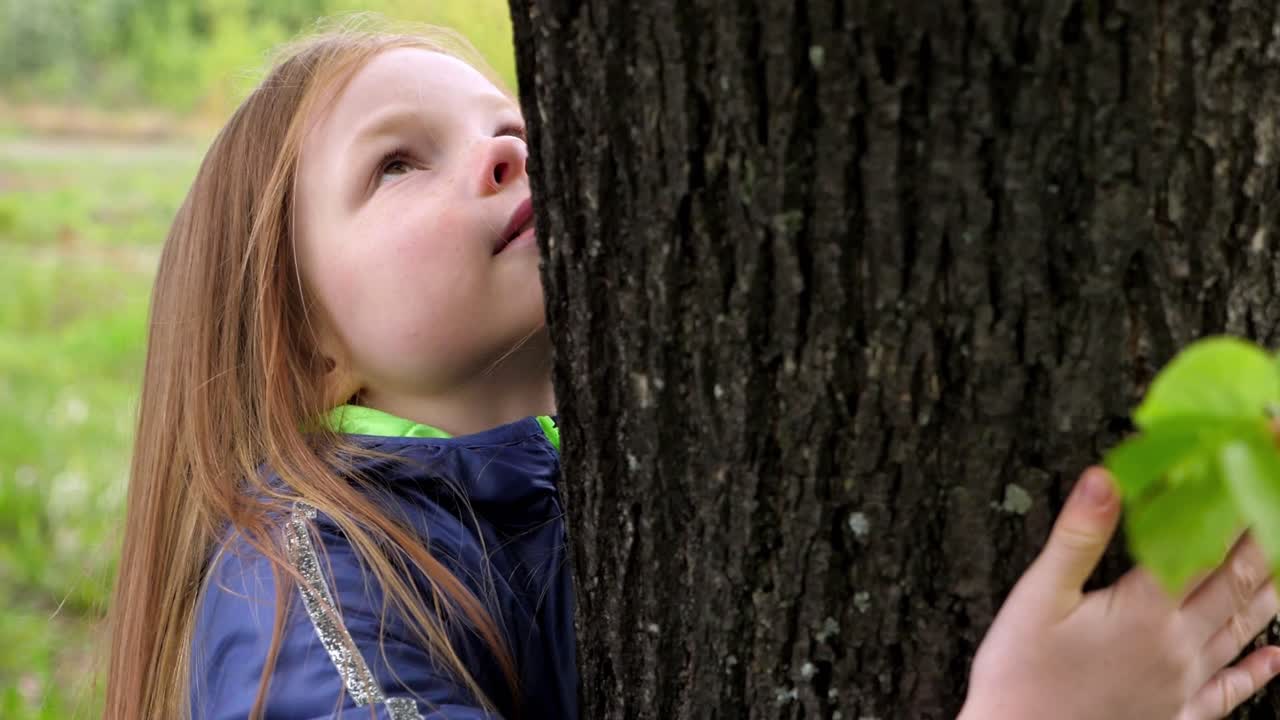 Girl Hugging a Tree