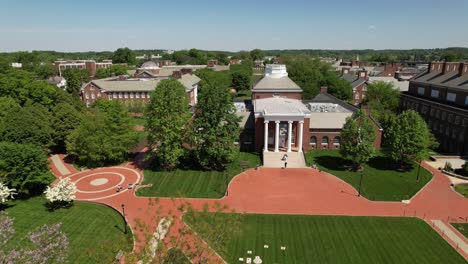 university of delaware descending drone shot of one of main campus buildings sunny day