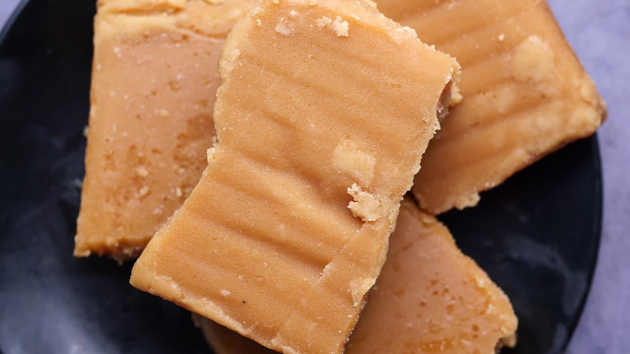 Jaggery traditional cane sugar cube on table