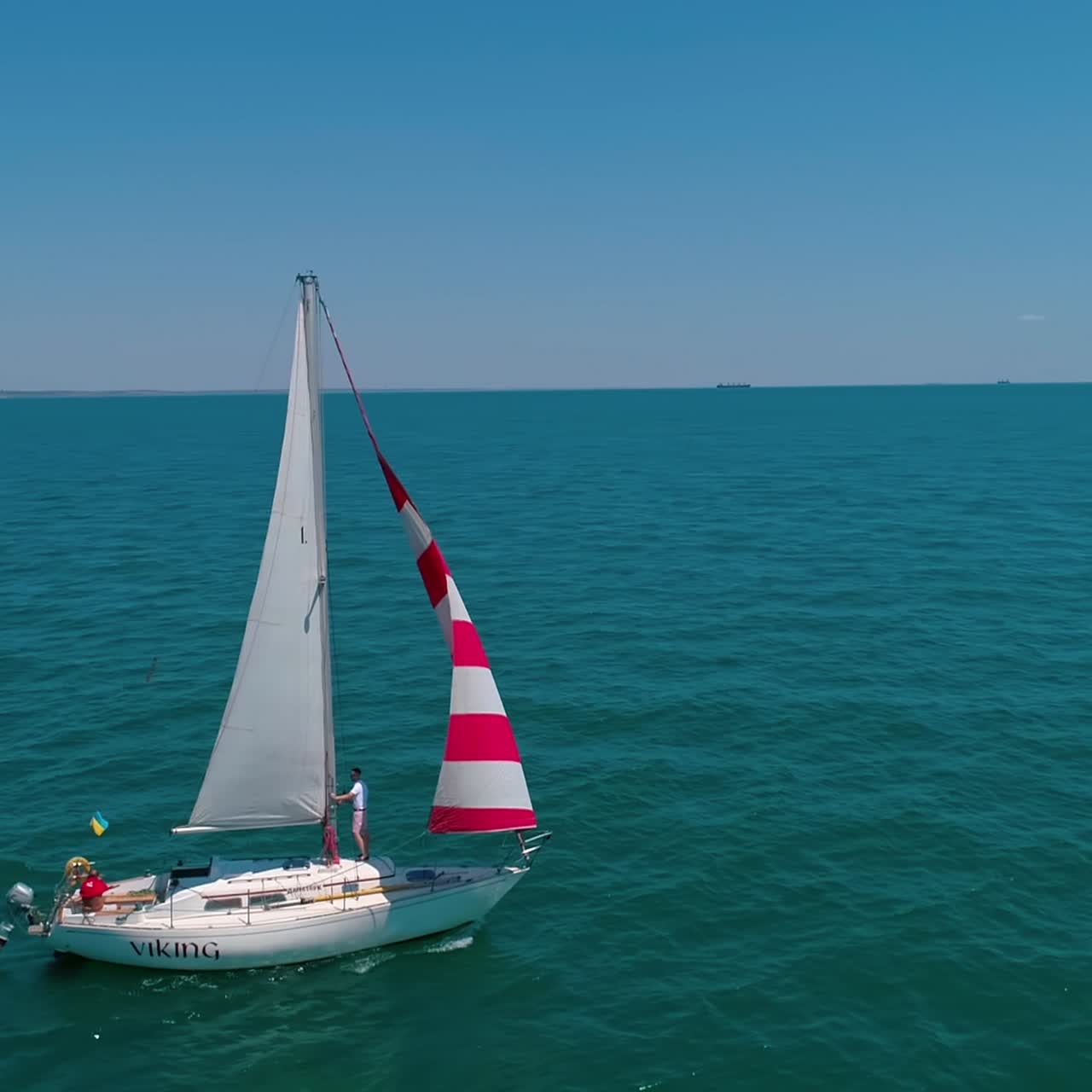Luxury ship at open sea. Aerial drone view of sailing yacht at sea bay