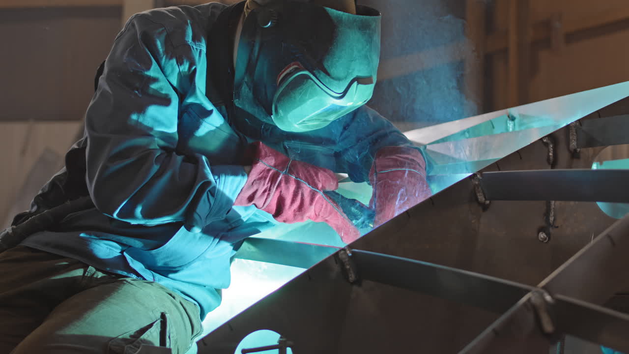 Welder at Work: Metal Fabrication and Construction