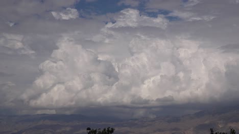 huge thunderclouds and thunderheads suggest an approaching storm