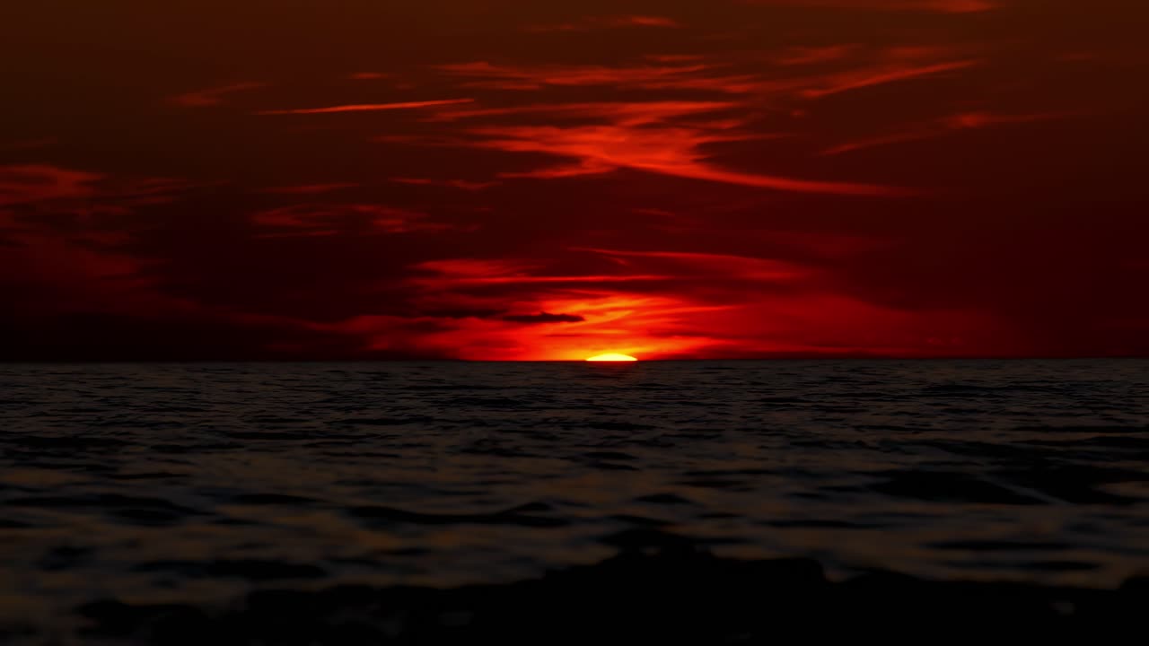 Cloudy sunset in Istria Croatia time lapse with deep orange sky above dark blue sea and waves