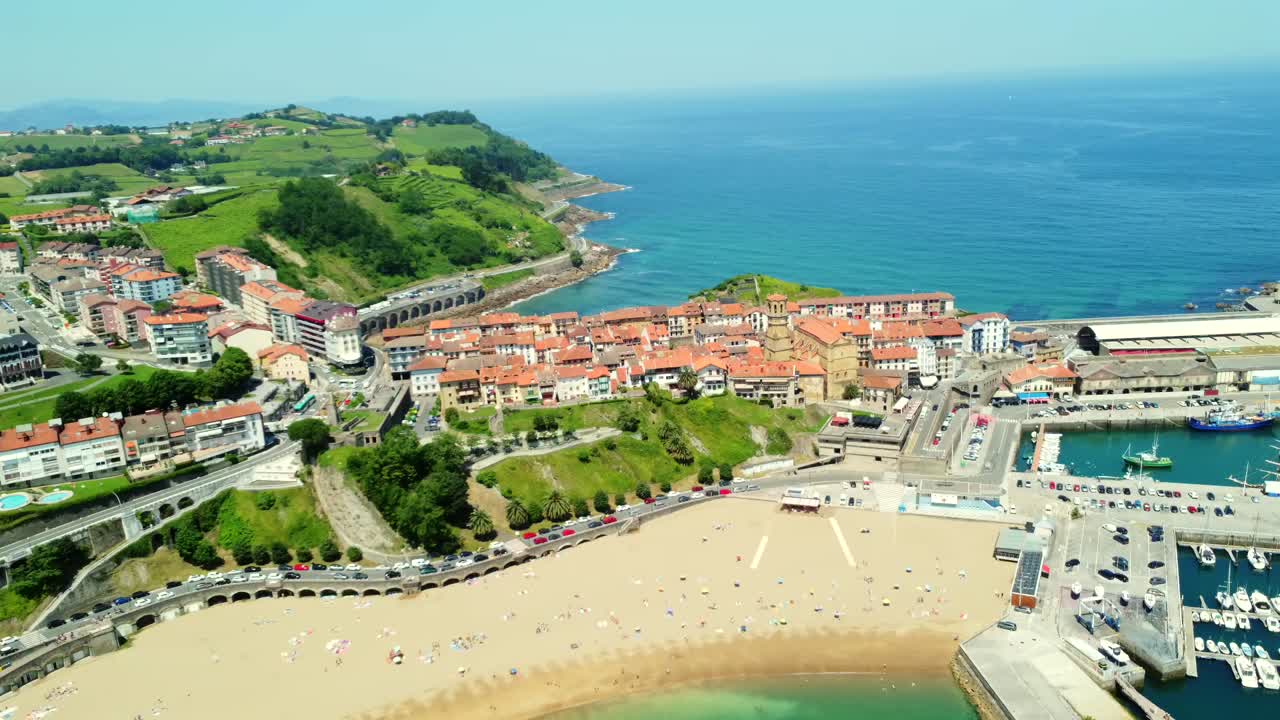 Aerial view of a coastal town with beach and ocean