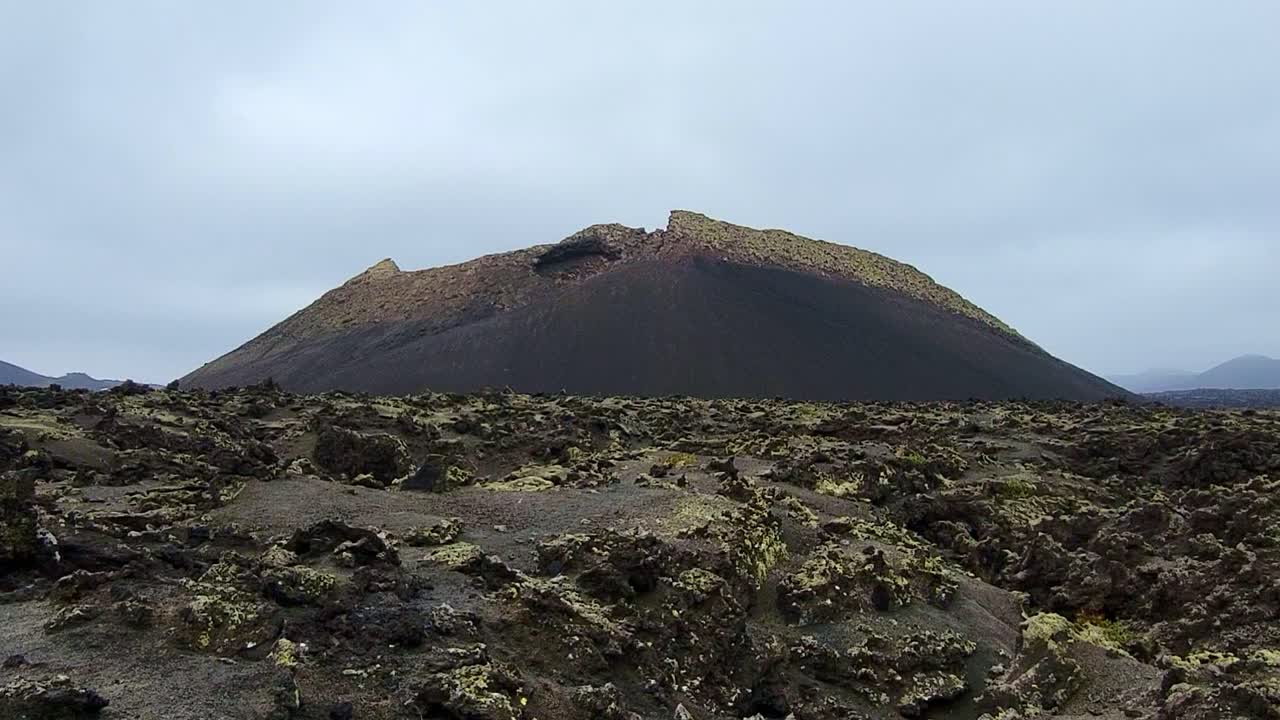 Crow volcano. Volcano crater and volcanic lava landscape. Lava sea. Lanzarote. Canary Islands.