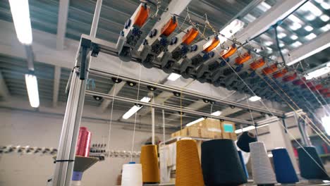 spools of thread on knitting machine