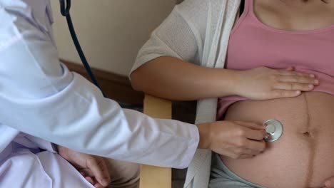 pregnant woman and gynecologist doctor at hospital