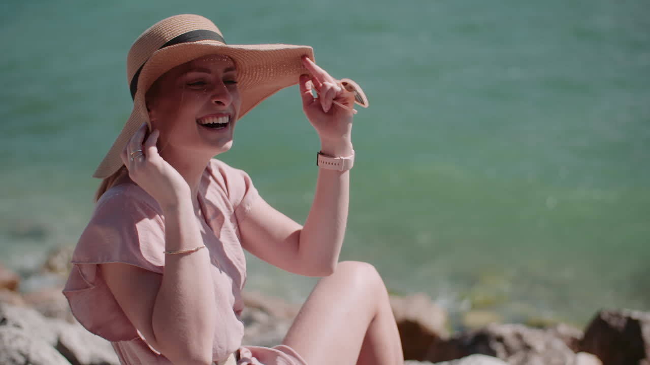 Happy Woman with Sun Hat by Serene Beach