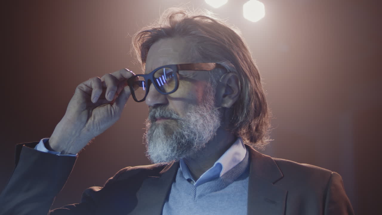 Thoughtful Mature Man with AR Glasses