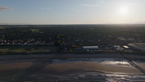 drone clip showing sandy beach and seaside town of blyth, northumberland