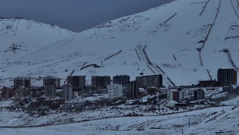 Aerial-establishing-shot-of-large-ski-resorts-at-the-base-of-the-El-Colorado-Slope