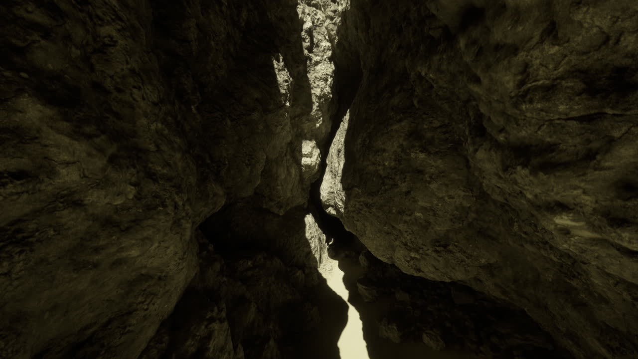 Exploring the narrow canyon with light filtering through high rock walls