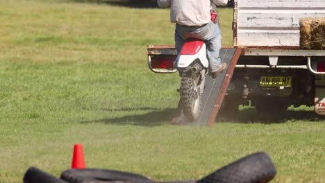 rider performs a motorcycle jump from a stationary truck