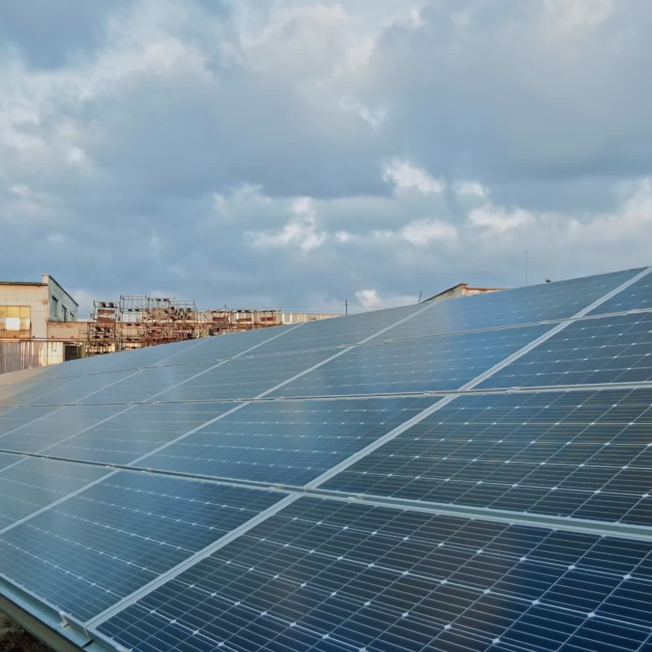 Blue solar battery outdoors. Photovoltaic solar panel on the farm. Renewable green alternative energy concept. Slow motion. Close-up.