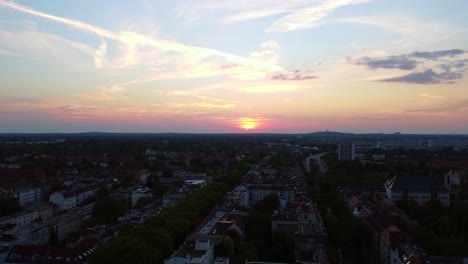 long flight towards the sun
tranquil aerial view flight fly forward drone
of berlin steglitz germany at summer sunset august 2022