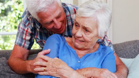 Senior-couple-talking-in-sitting-room