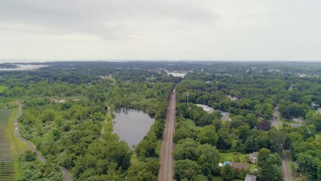 high altitude static aerial of distant approaching train