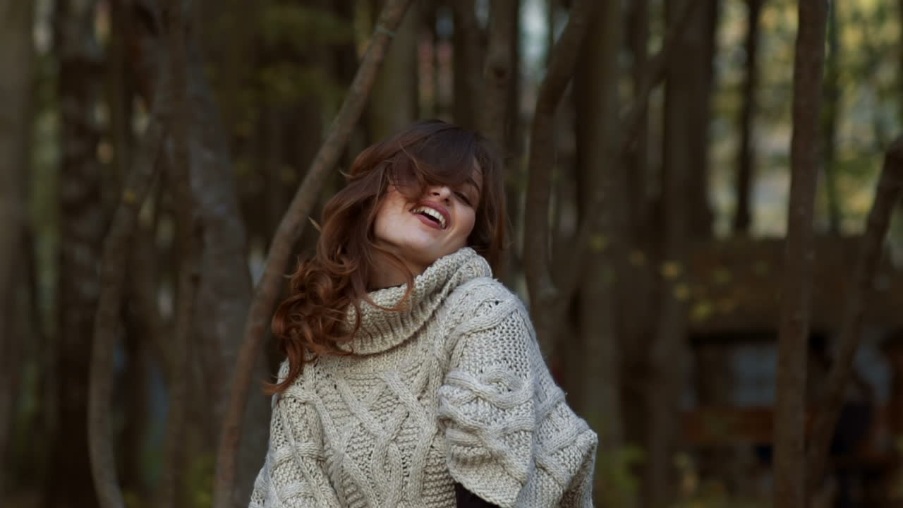 Woman posing in park. Happy young woman posing in autumn park