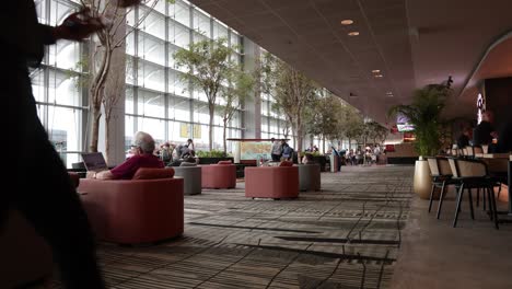 people socializing in a spacious indoor lounge