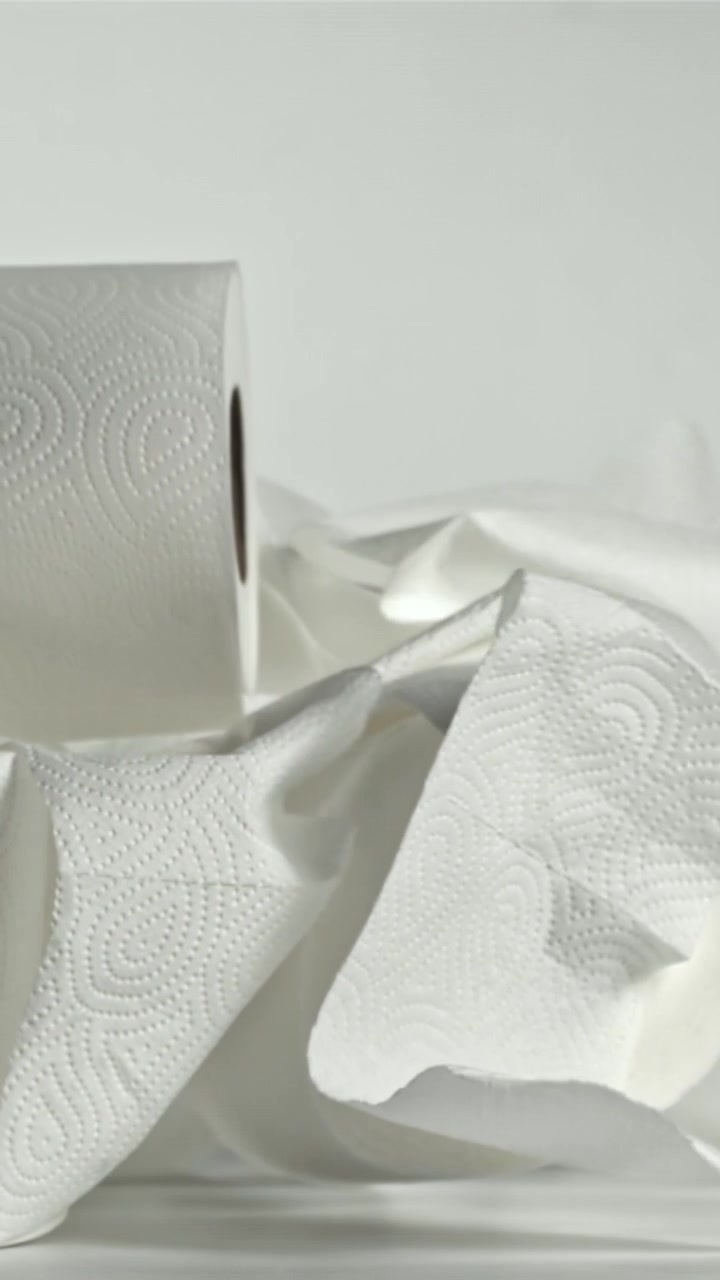 Slow Motion of Toilet Paper and Paper Towel Rolls Falling