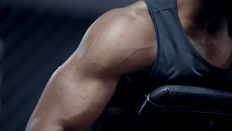 african american man performs chest-supported row exercise