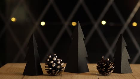 handmade christmas decorations with pine cones and bokeh lights background slider shot