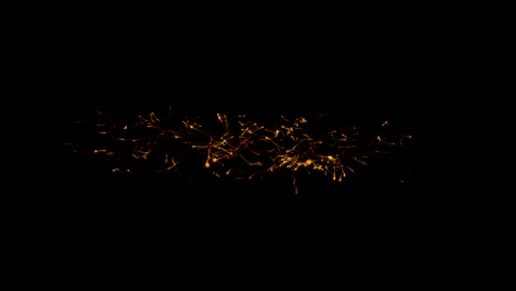 rapid movement of luminous gold-colored microparticles on a black background 4k