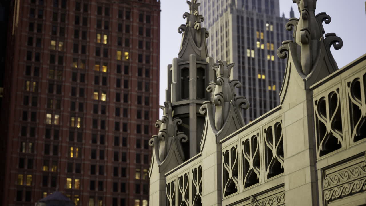 Historic architectural details illuminated at dusk in a city skyline