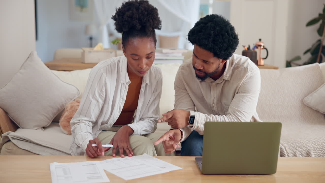 A couple doing financial planning at home