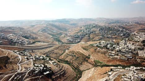 aerial footage over east jerusalem judea desert and arab neighborhoods