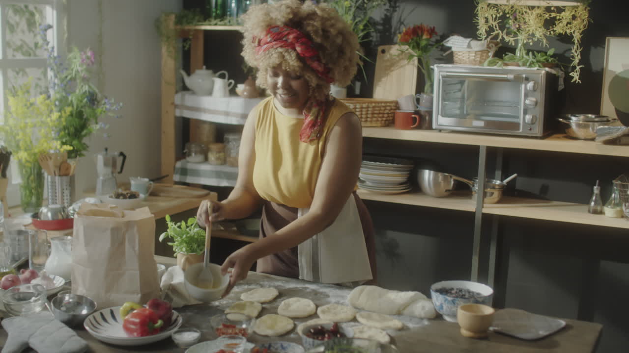 Woman Baking Dough in a Bright Home Kitchen