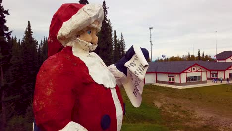 4k drone video of santa claus statue in north pole, alaksa during summer day