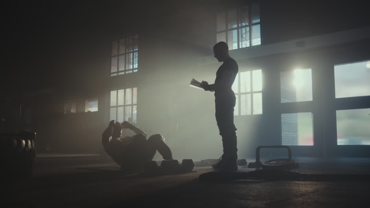 Man Doing Crunches with a Trainer