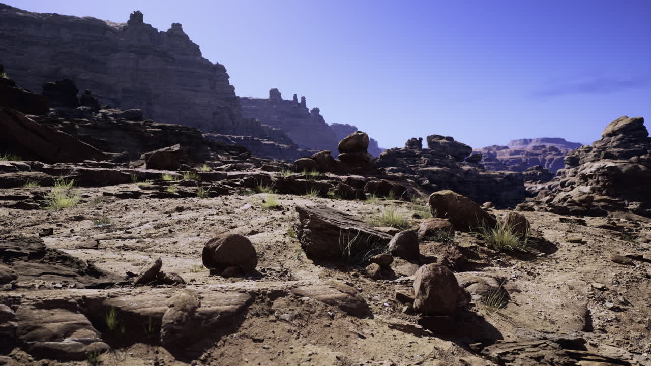 Rocky landscape with towering formations under clear blue sky
