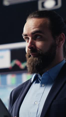 vertical video professional businessman analyzing info and finance charts on digital dashboard