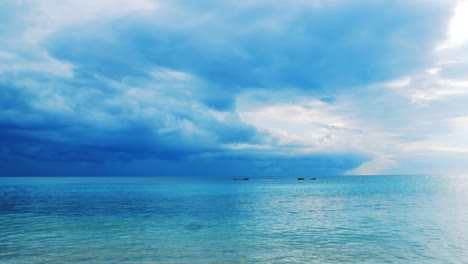 caribbean sea rippling gently in calm before the storm with cloudy sky
