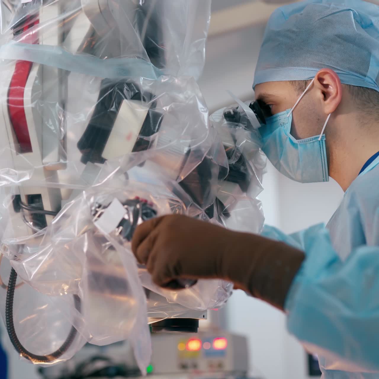 Neurosurgery in clinic. Professional doctors doing a surgery through the new electronic operating microscope. Surgeons use modern equipment. Health care concept.