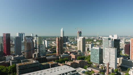 High-rise-Offices,-Hotels,-And-Market-Hall-On-A-Sunny-Day-In-Rotterdam,-South-Holland,-Netherlands