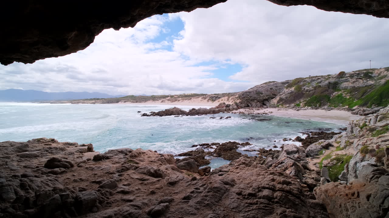 View from Klipgat Cave toward scenic Die Plaat coastline and beach, De Kelders