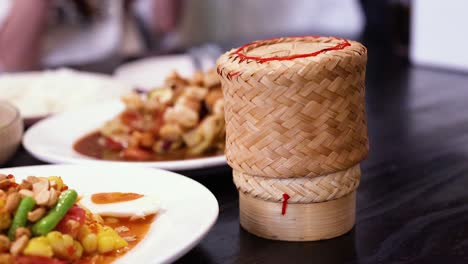 traditional sticky rice served with thai dishes